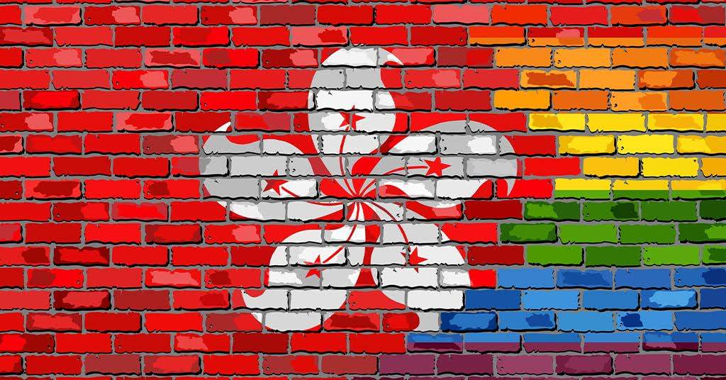 Mental health advocacy: LGBTQ+ flag and Hong Kong flag on brick wall