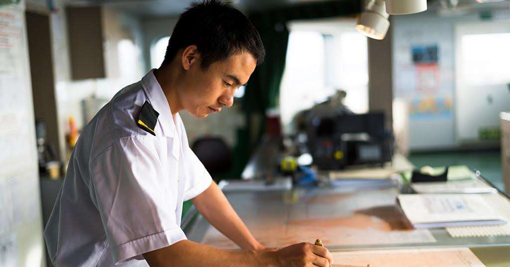 A captain navigates a ship's route, highlighting the challenges of suicide and loneliness among seafarers, with the sea symbolizing their isolation and mental health struggles.