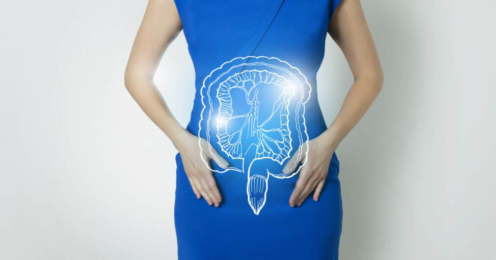 An image of a woman wearing a blue dress with her hands on her abdomen with a picture of the intestine showcasing the gut.