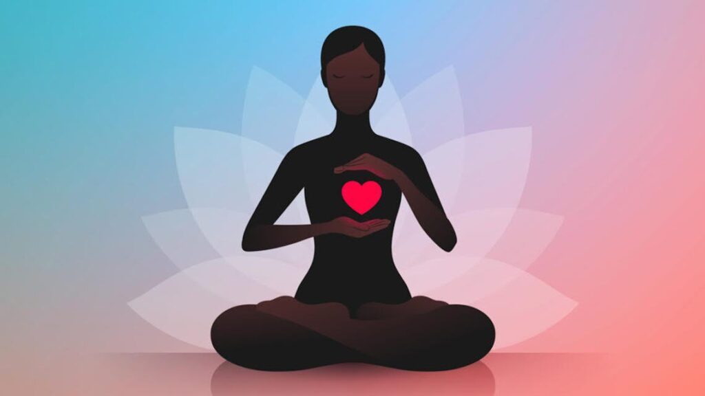 An image of a black idol sitting in a yoga position meditating with a pink heart symbol