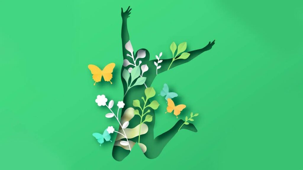 A stylized silhouette of a woman jumping with happiness, illustrated with flowers, leaves and butterflies.